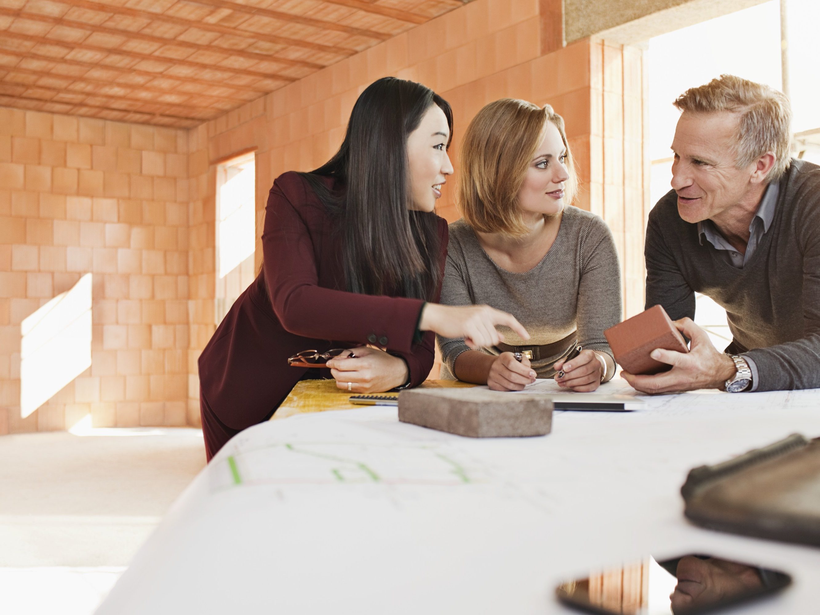 Group of people talking about building materials